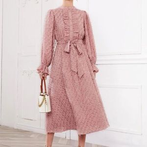 its an elegant front-frill trim fuzzy dress.